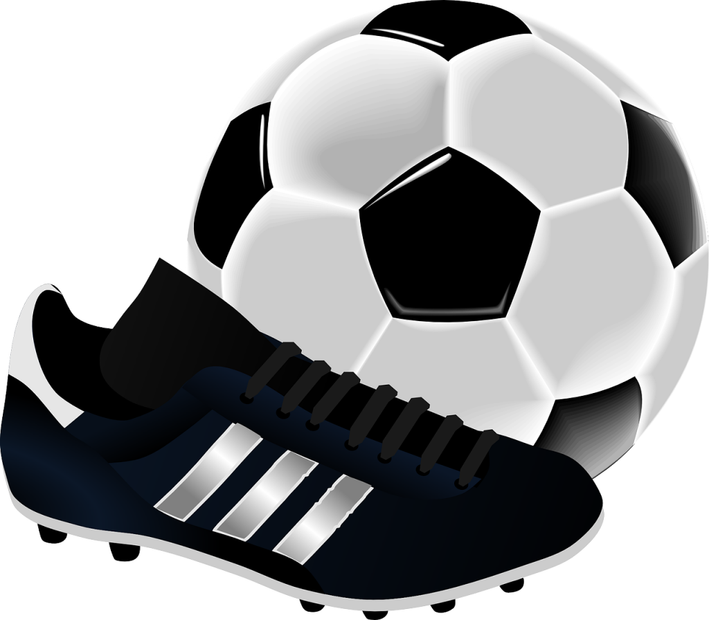 Das Bild zeigt einen Fußball und Fußballschuhe.